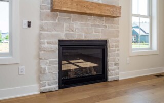 fireplace with large rustic mantel