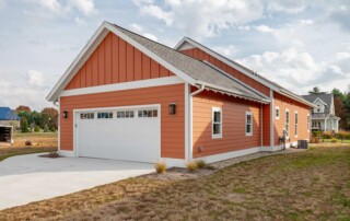 view of garage and new concrete driveway
