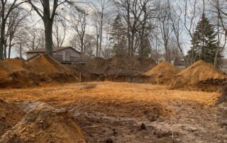 newly excavated area with stakes
