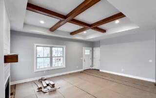 large room with beamed ceiling