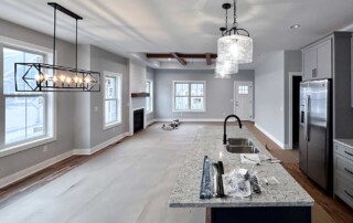 view down kitchen island looking into open living area