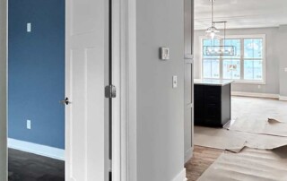 hallway leading to bright living area