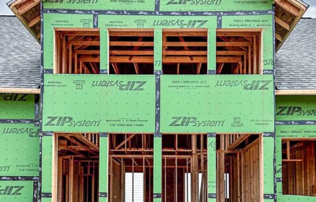 eight windows in two story section of unfinished custom home
