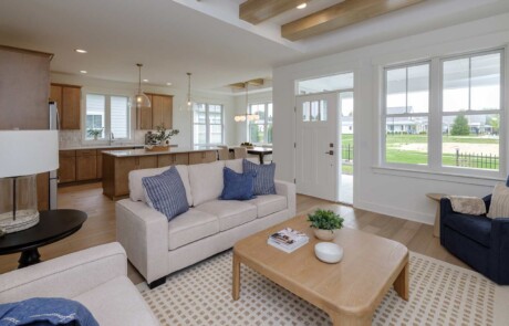 living area with exposed ceiling beams