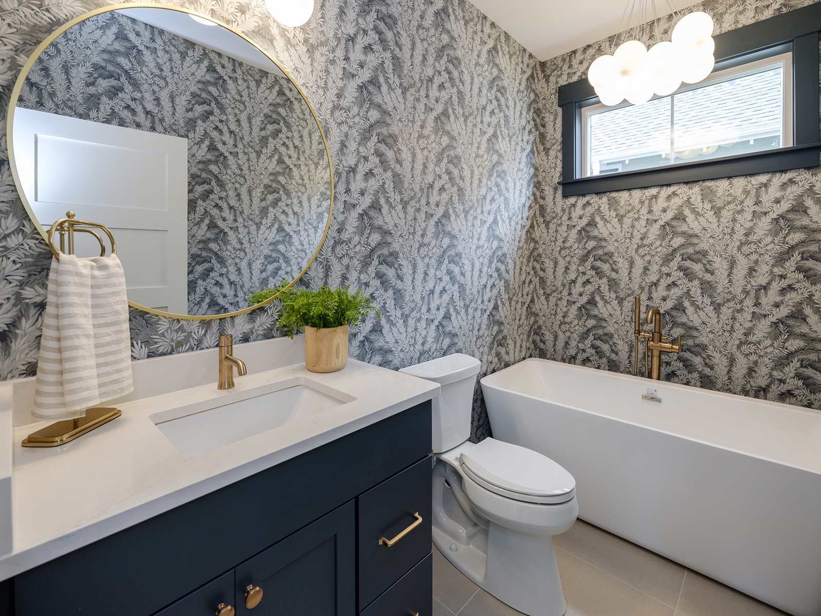 bright bathroom with grey patterned wallpaper