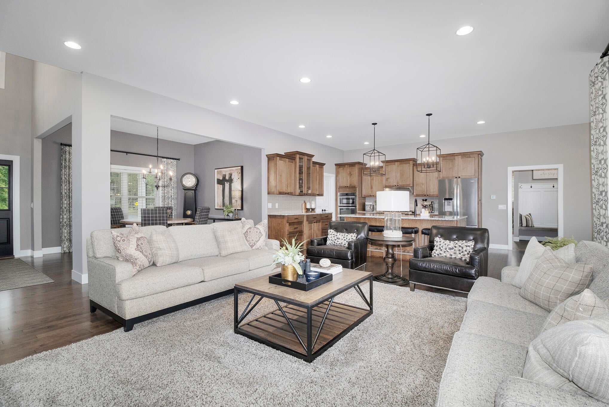 open living room with kitchen in background