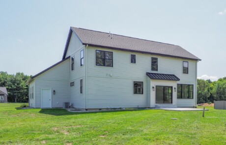 rear view of two story white home